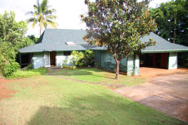 4332 Punee Road Koloa, HI 96756 - Photo 2 of 24 a house with trees in front of it