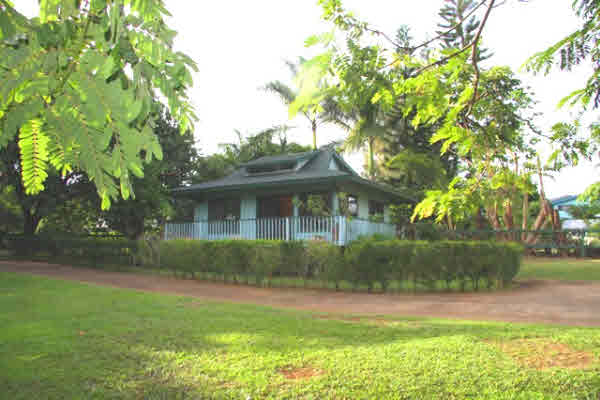 4332 Punee Road Koloa, HI 96756 - Photo 6 of 24 a front view of a house with garden