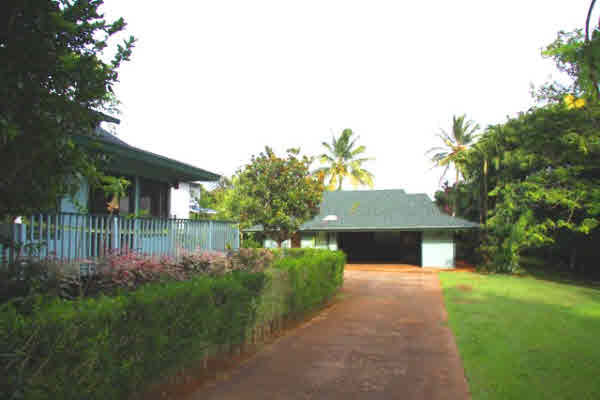 4332 Punee Road Koloa, HI 96756 - Photo 8 of 24 a front view of a house with garden
