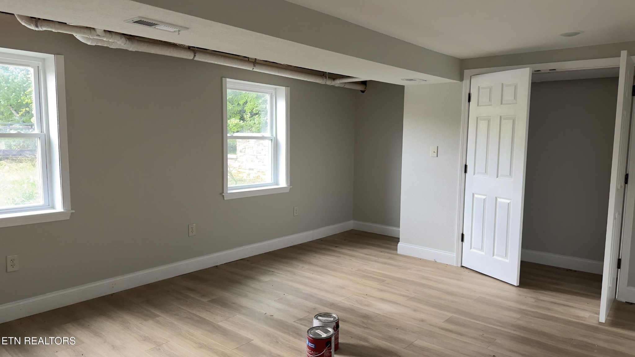2662 Louisville Road Maryville, TN 37801 - Photo 31 of 60 a view of an empty room with wooden floor and a window