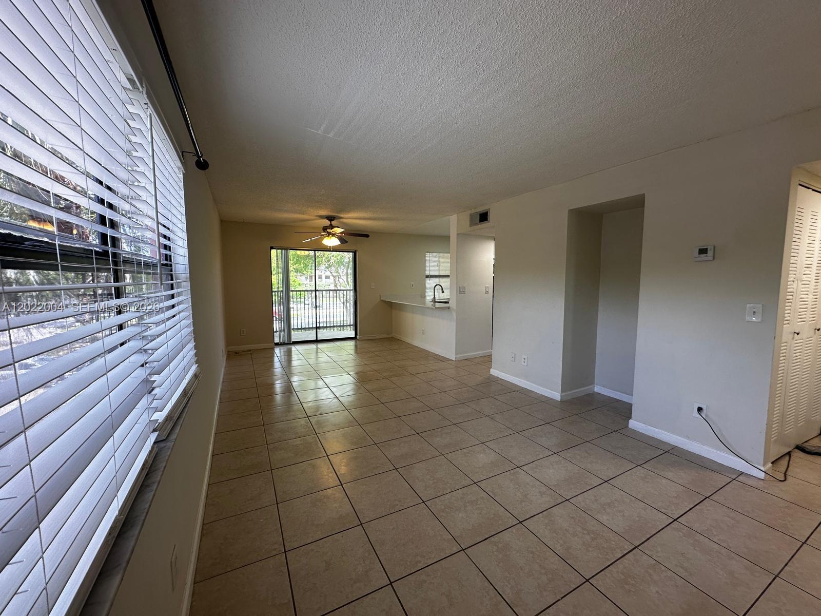3400 Foxcroft Road, Unit 301 Miramar, FL 33025 - Photo 61 of 72 a view of a hallway with wooden floor