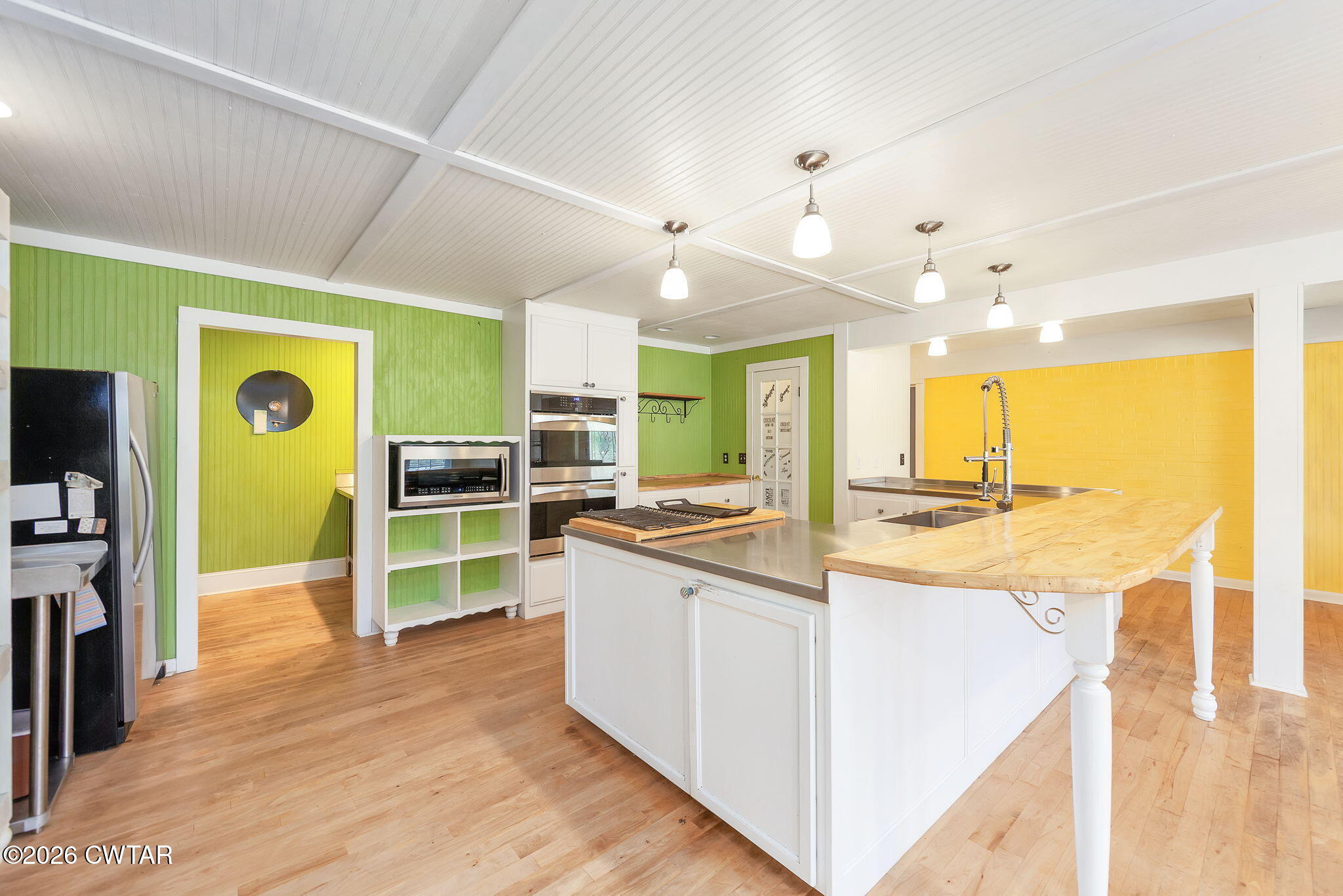 3875 Terry Road Huntingdon, TN 38344 - Photo 12 of 43 a kitchen with kitchen island a counter top space a sink stainless steel appliances and cabinets