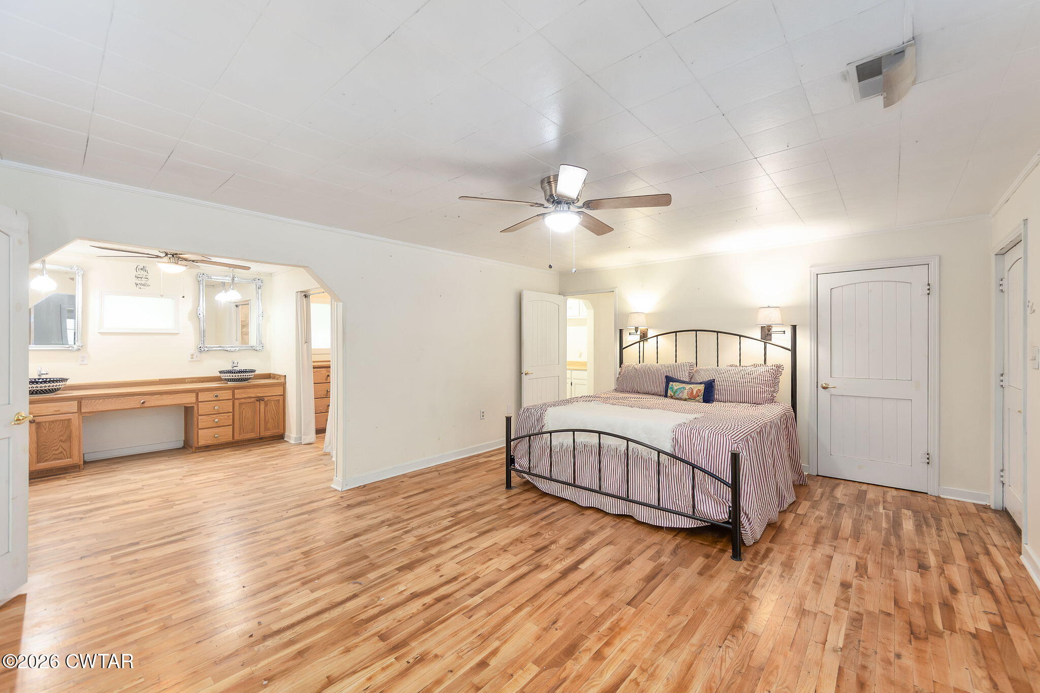 3875 Terry Road Huntingdon, TN 38344 - Photo 17 of 43 a bedroom with furniture and a wooden floor
