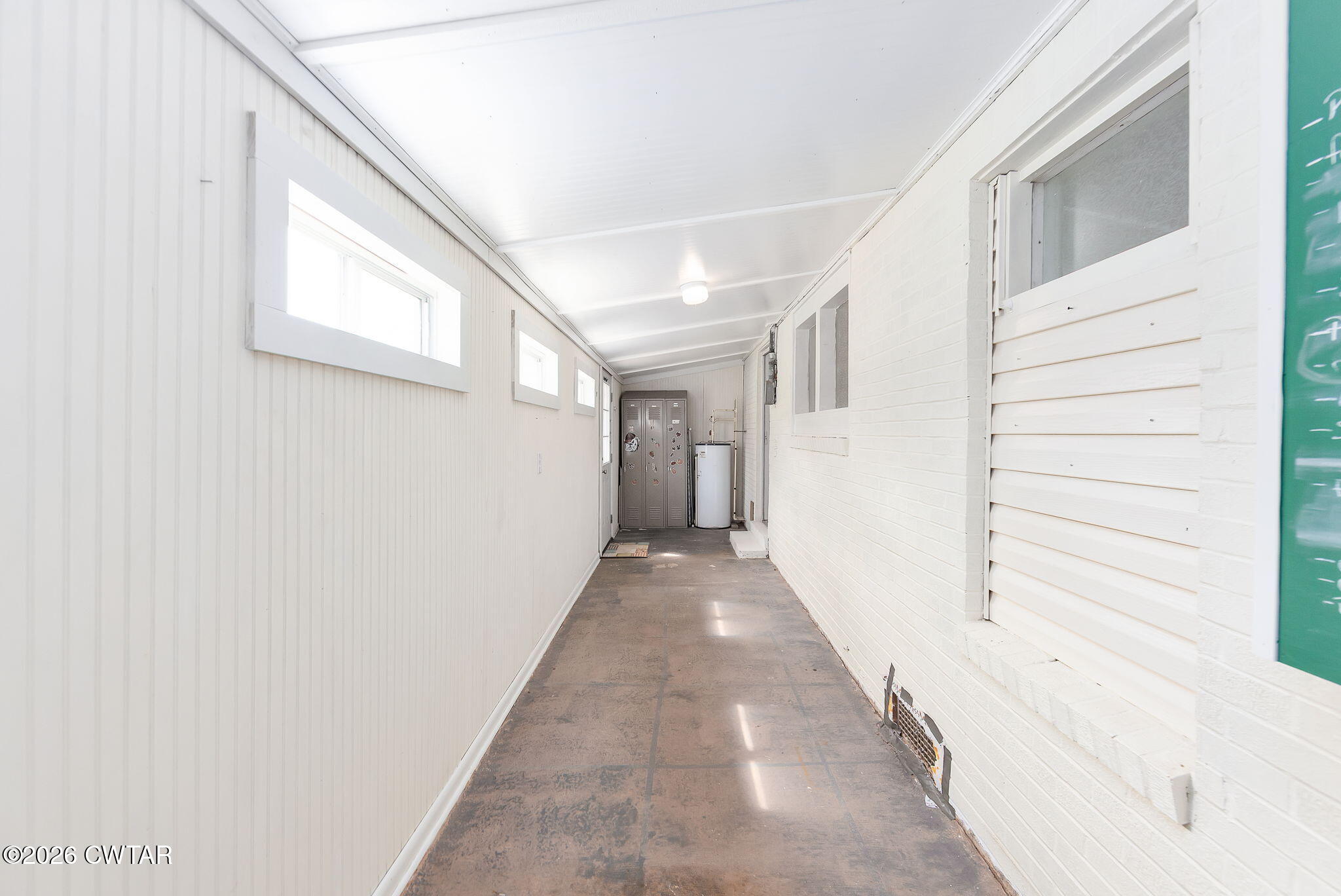 3875 Terry Road Huntingdon, TN 38344 - Photo 25 of 43 a view of a hallway with wooden floor and staircase