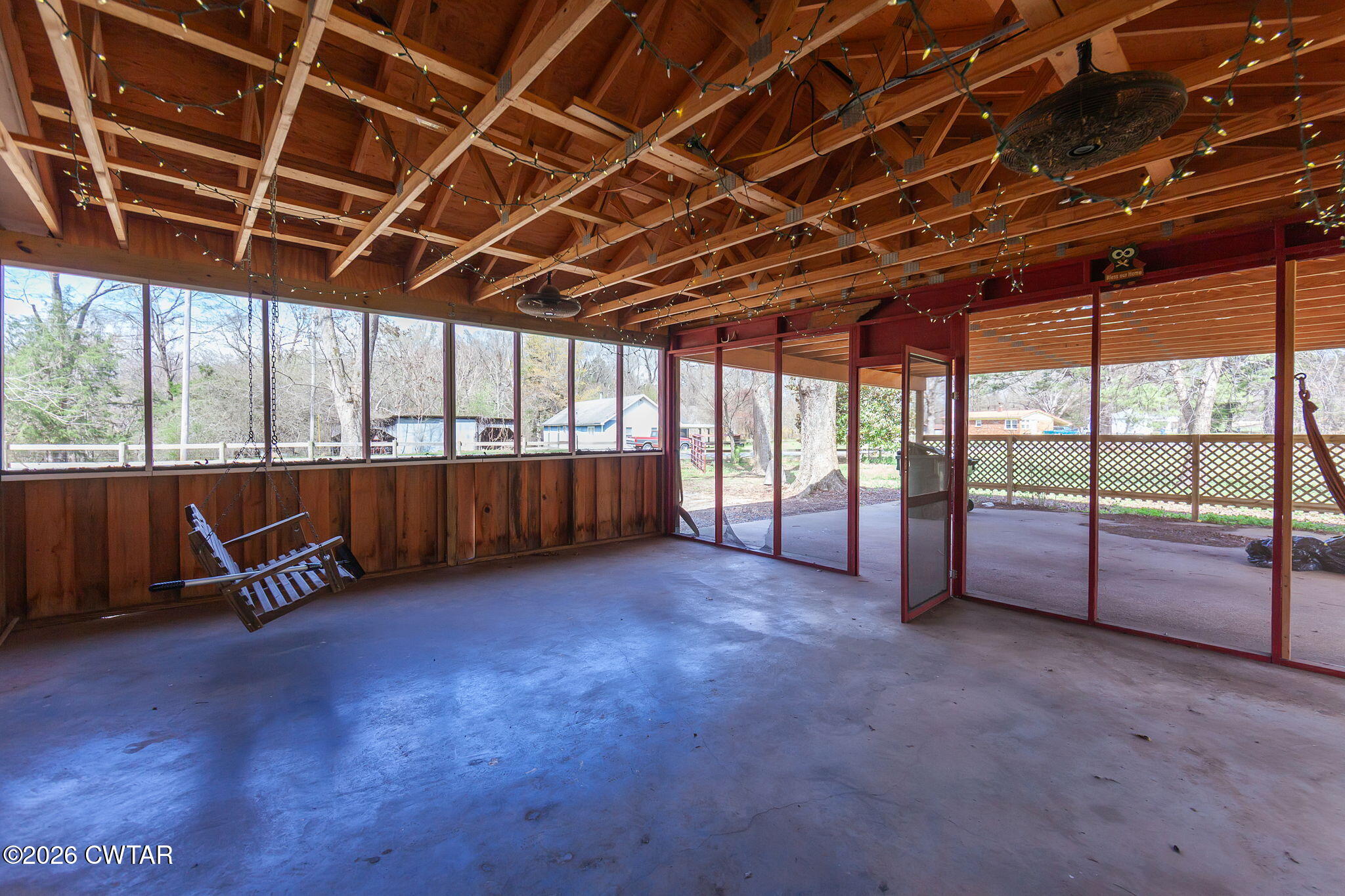 3875 Terry Road Huntingdon, TN 38344 - Photo 30 of 43 a view of an empty room with a chair and wooden floor