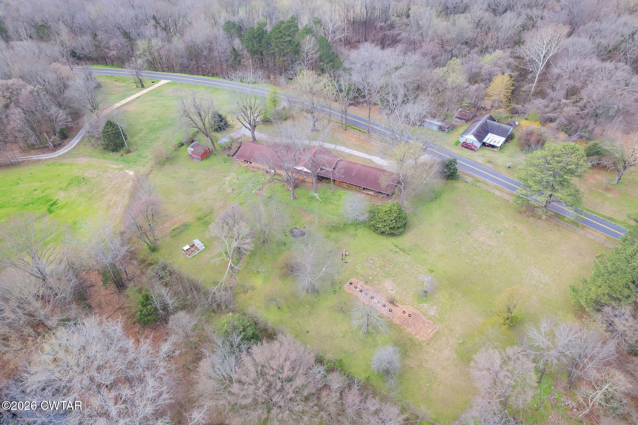 3875 Terry Road Huntingdon, TN 38344 - Photo 34 of 43 a backyard of a house with lots of green space