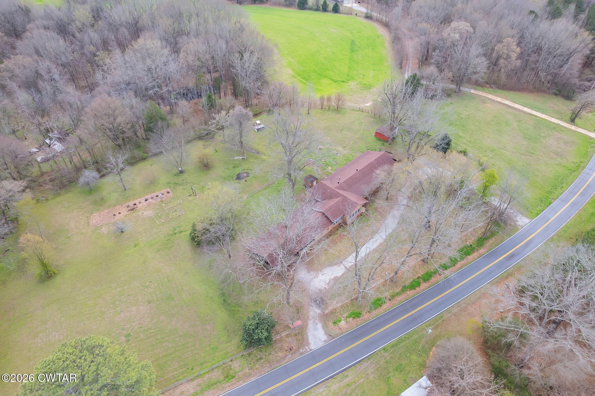 3875 Terry Road Huntingdon, TN 38344 - Photo 36 of 43 a view of a swimming pool with a yard