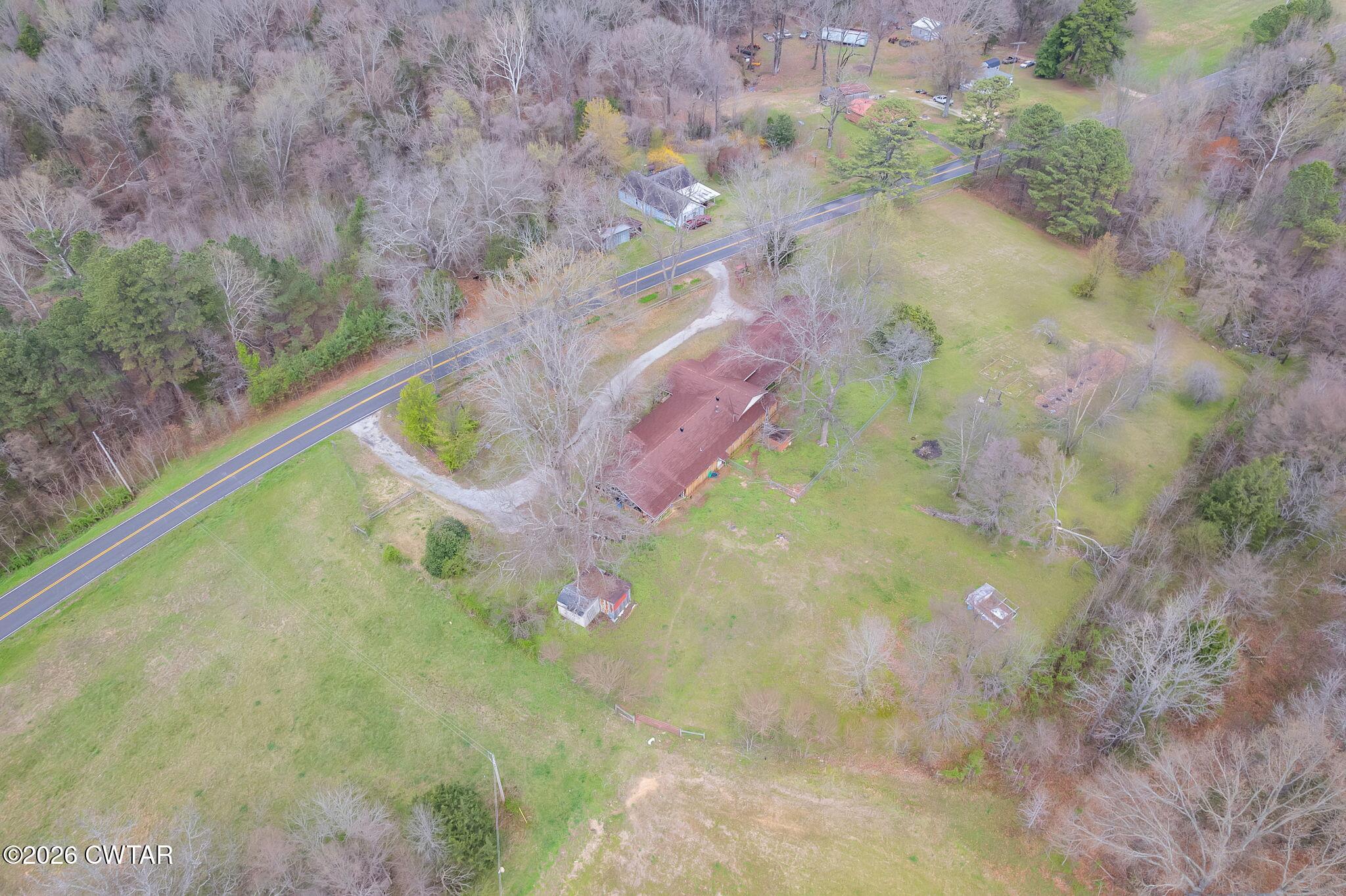 3875 Terry Road Huntingdon, TN 38344 - Photo 38 of 43 a view of a swimming pool with a yard