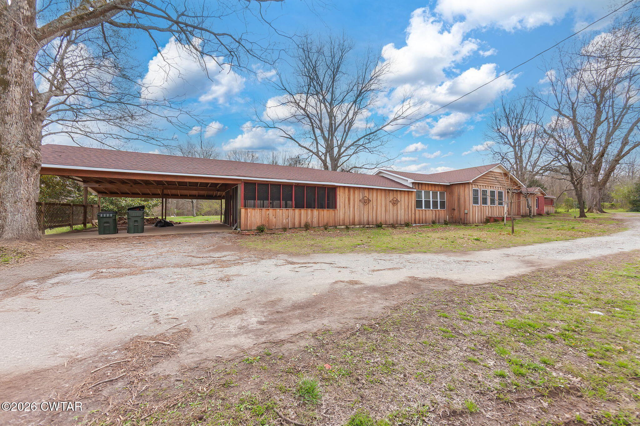 3875 Terry Road Huntingdon, TN 38344 - Photo 4 of 43 a view of swimming pool with outdoor seating and house in the background
