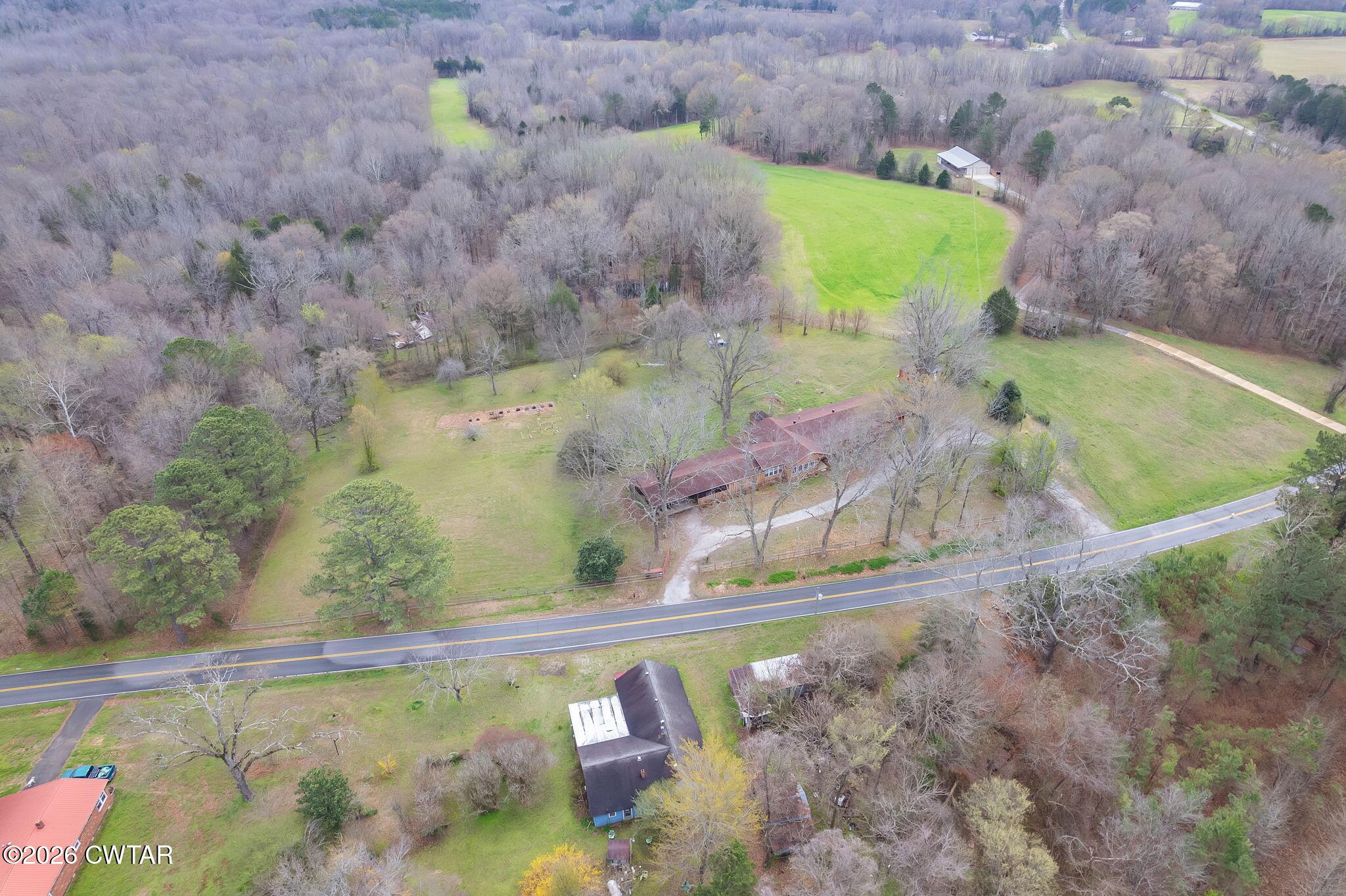 3875 Terry Road Huntingdon, TN 38344 - Photo 41 of 43 a view of a yard with an outdoor space