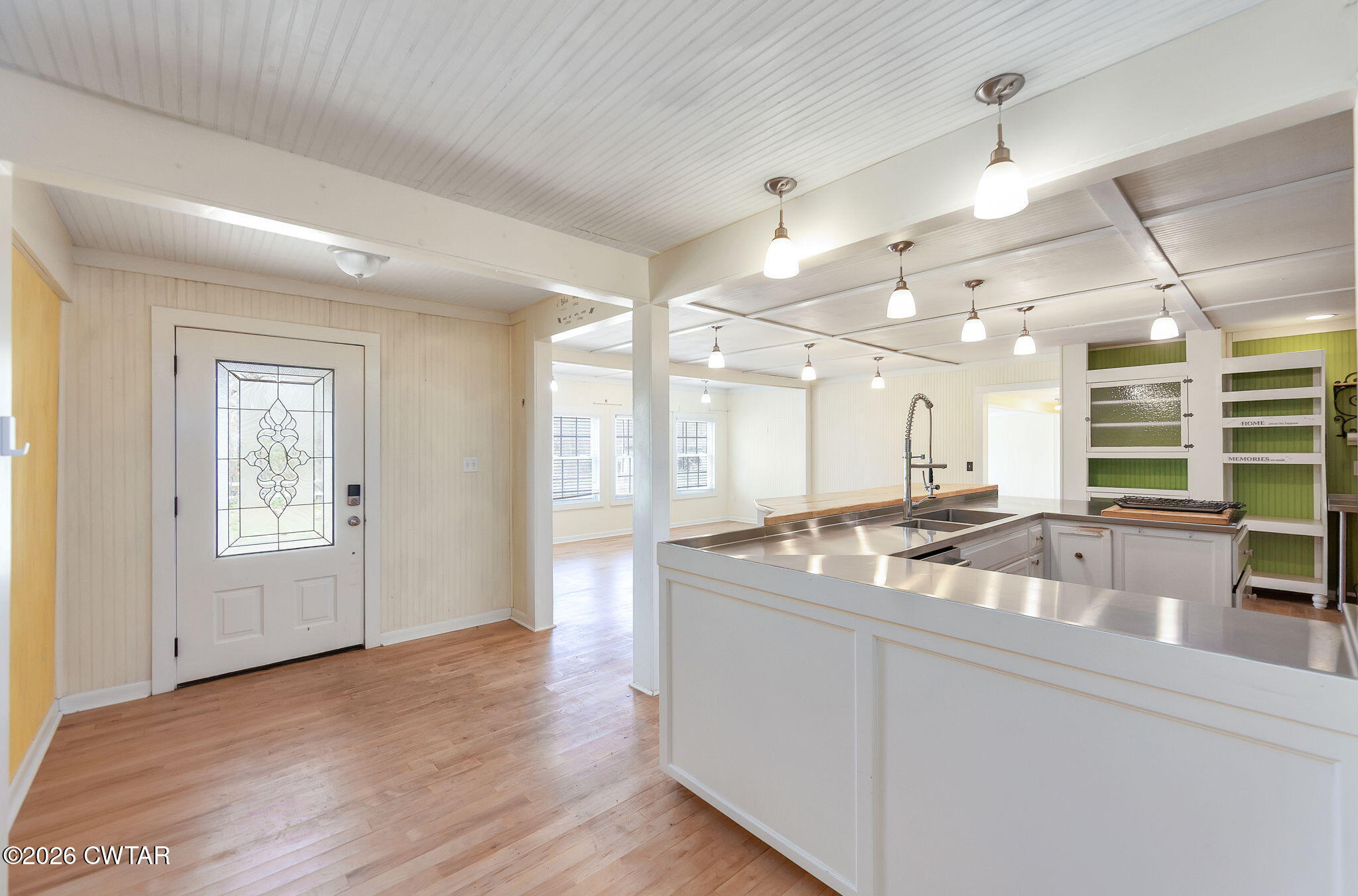 3875 Terry Road Huntingdon, TN 38344 - Photo 6 of 43 a dining hall with stainless steel appliances granite countertop a sink a granite counter tops and a large window
