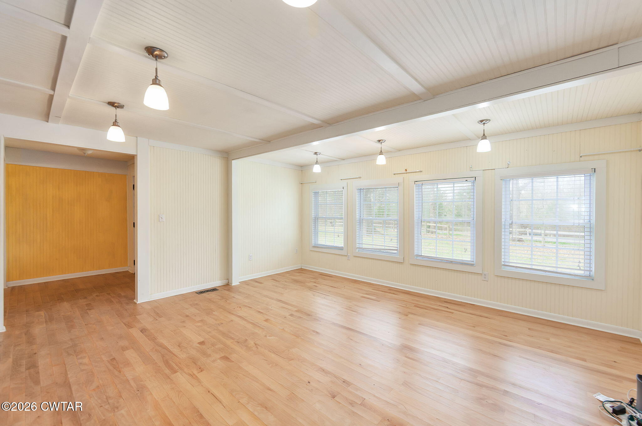 3875 Terry Road Huntingdon, TN 38344 - Photo 7 of 43 a view of an empty room with wooden floor and a window