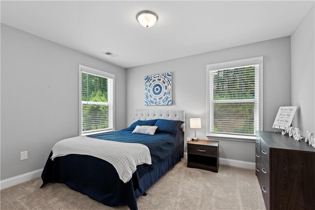 540 Glen Abbey Circle Mableton, GA 30126 - Photo 33 of 47 a bedroom with a bed and a window