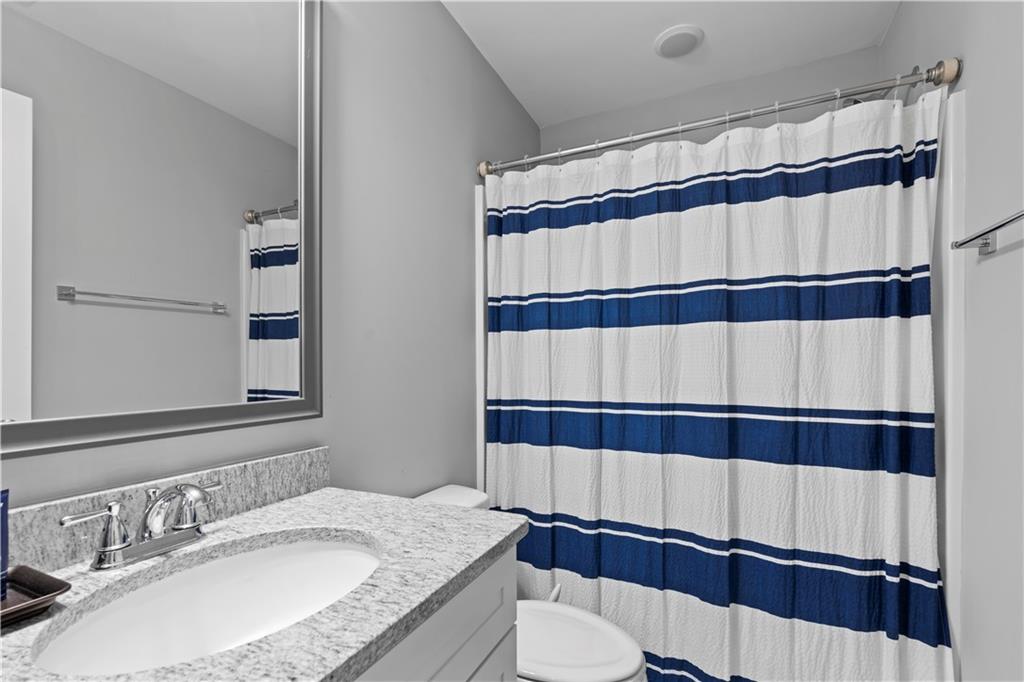 540 Glen Abbey Circle Mableton, GA 30126 - Photo 34 of 47 a bathroom with a sink and a mirror