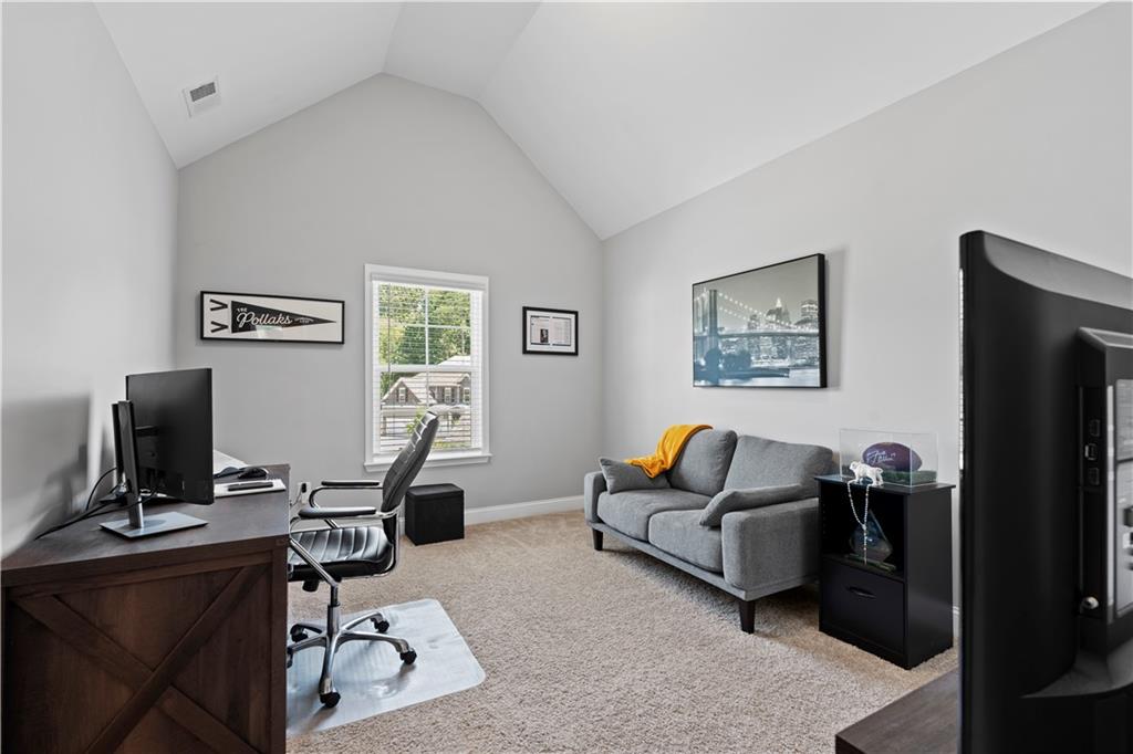 540 Glen Abbey Circle Mableton, GA 30126 - Photo 39 of 47 a living room with furniture and a flat screen tv