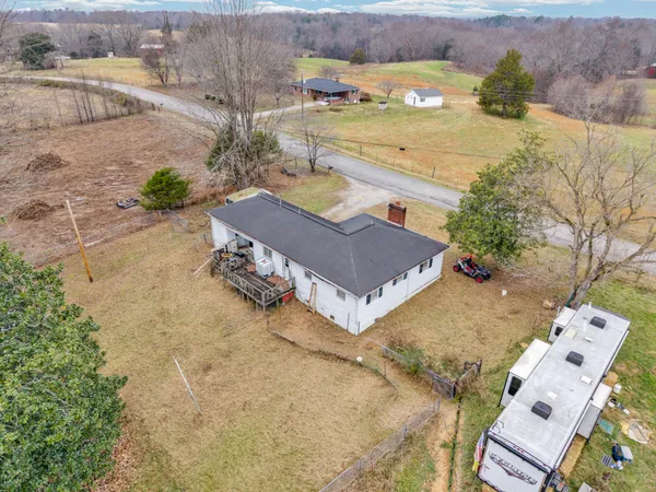 an aerial view of a house with outdoor space