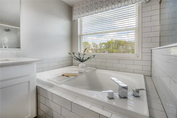 a bathroom with a sink and a bathtub