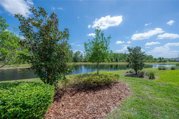 a view of a lake with a big yard