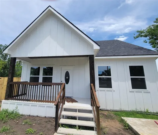 a front view of a house with deck