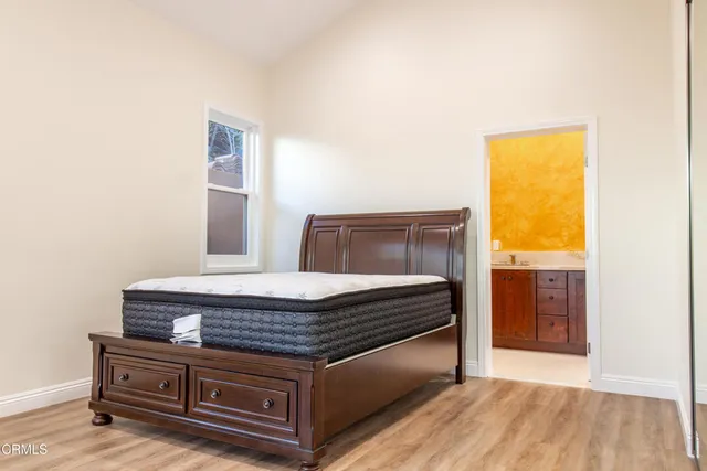 a room with a bed and a window