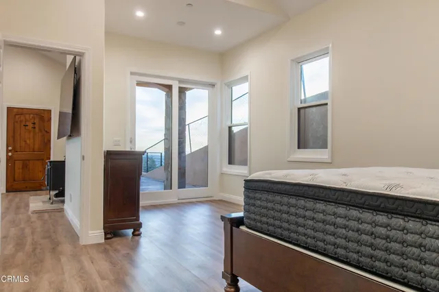 a room with wooden floor and a window