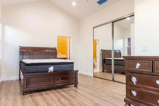 a view of room with furniture and wooden floor
