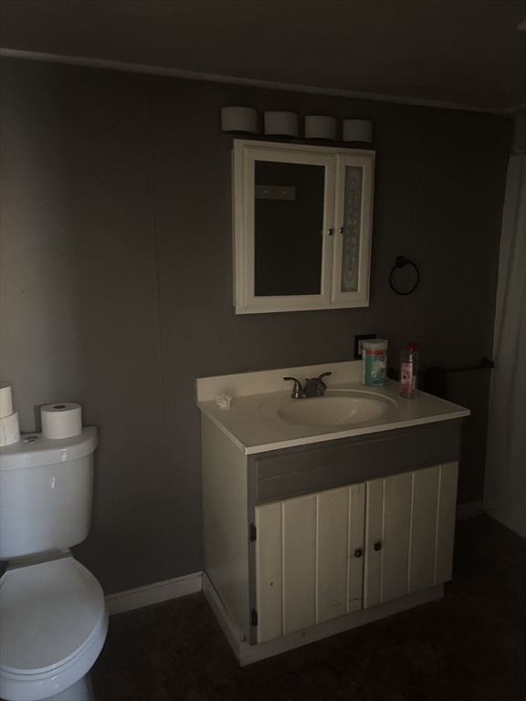 10 Cottage Street Belchertown, MA 01007 - Photo 19 of 40 a bathroom with a toilet sink and mirror