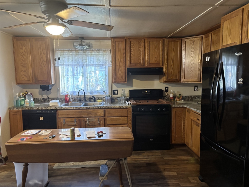 10 Cottage Street Belchertown, MA 01007 - Photo 24 of 40 a kitchen with a refrigerator and a stove top oven