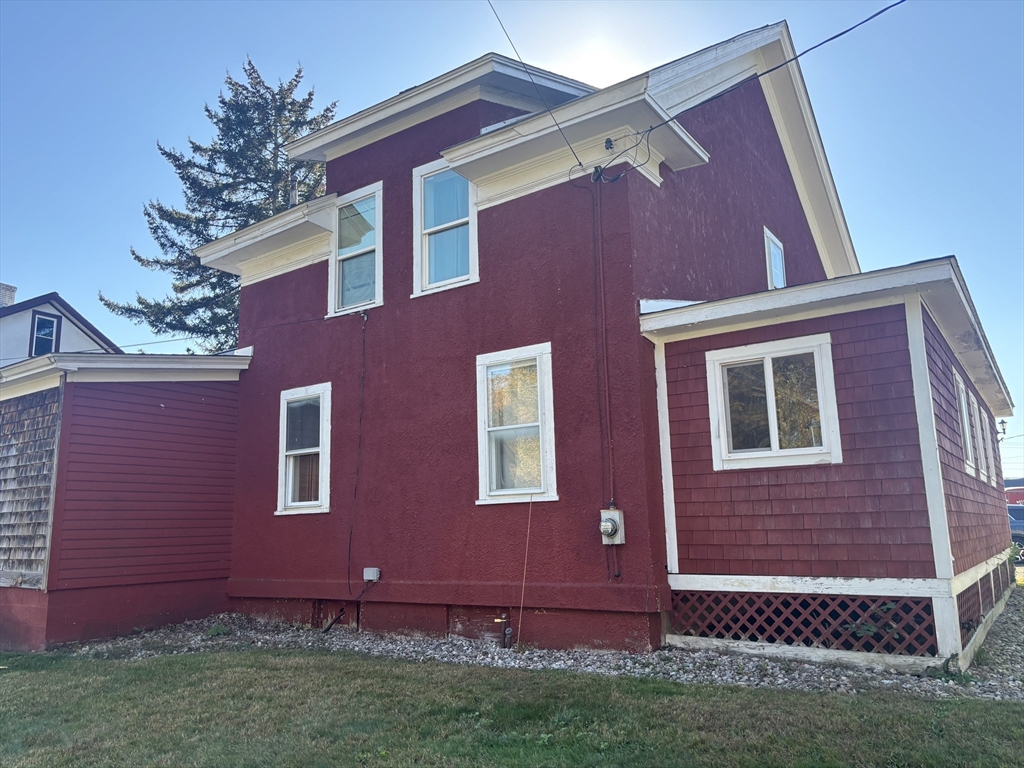 10 Cottage Street Belchertown, MA 01007 - Photo 4 of 40 a view of a brick house with a yard