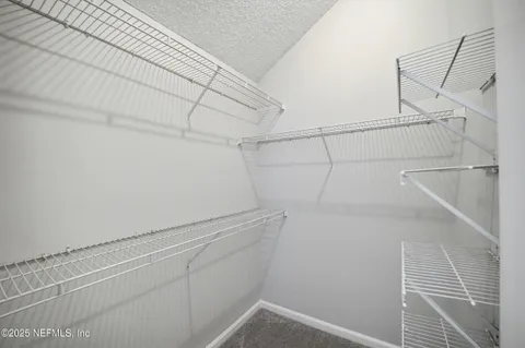 a view of a room with racks on the wall