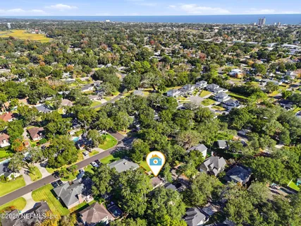 an aerial view of residential houses with outdoor space