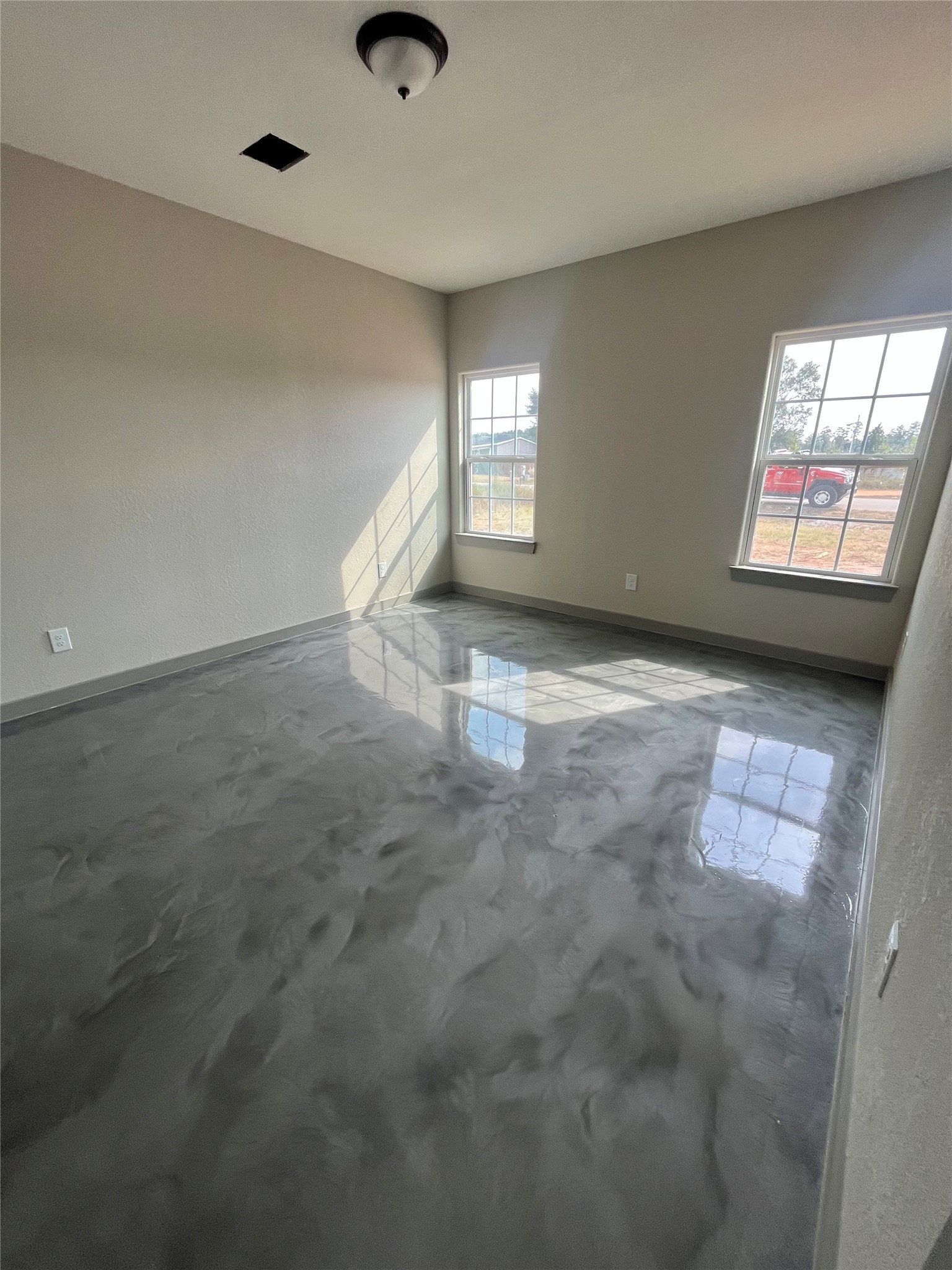 17539 Reno Road Conroe, TX 77306 - Photo 14 of 19 an empty room with windows and fireplace