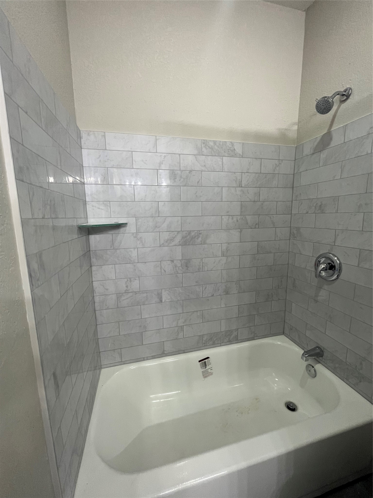 17539 Reno Road Conroe, TX 77306 - Photo 16 of 19 a bathroom with a bathtub