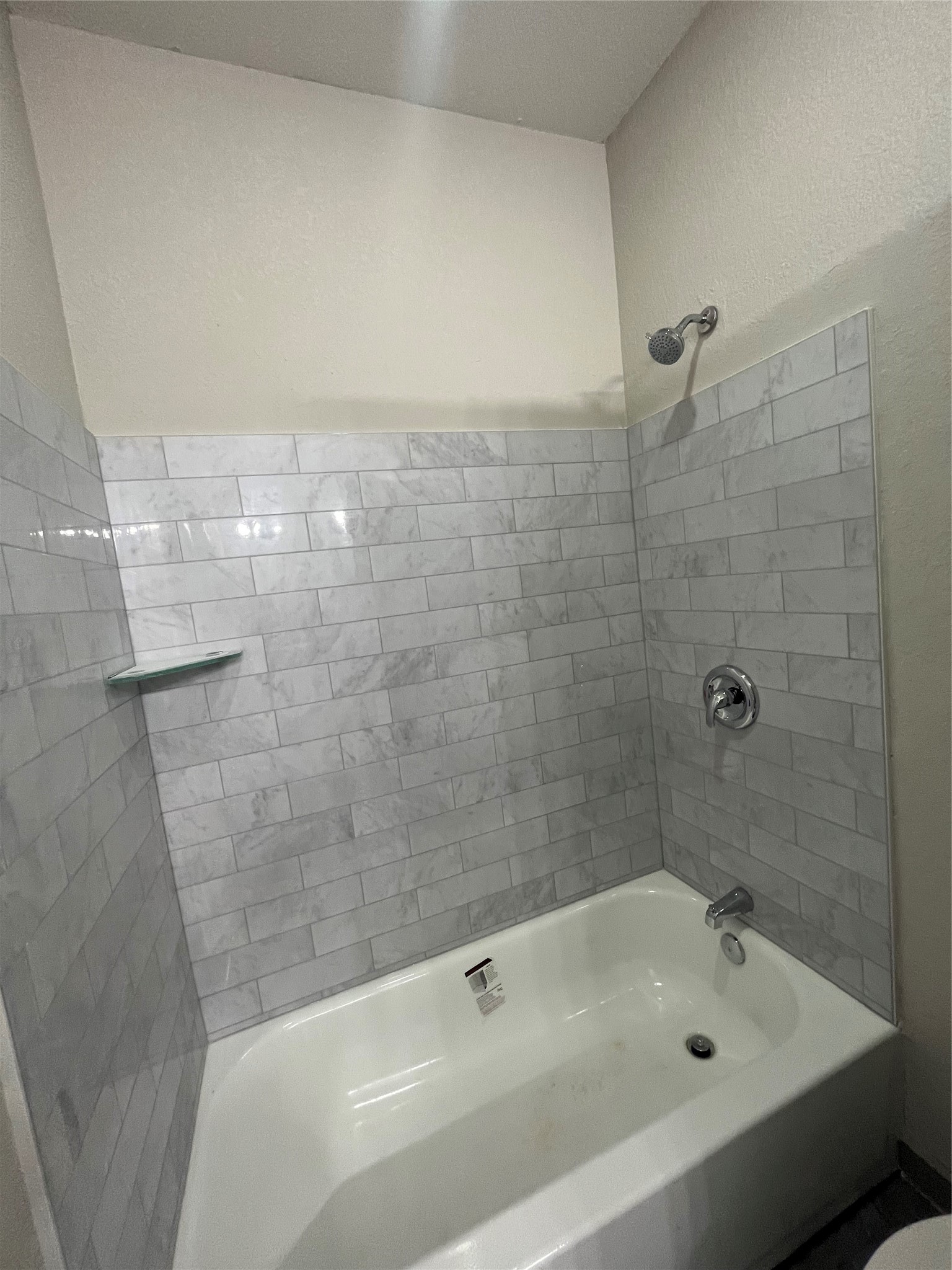 17539 Reno Road Conroe, TX 77306 - Photo 18 of 19 a bathroom with a bathtub