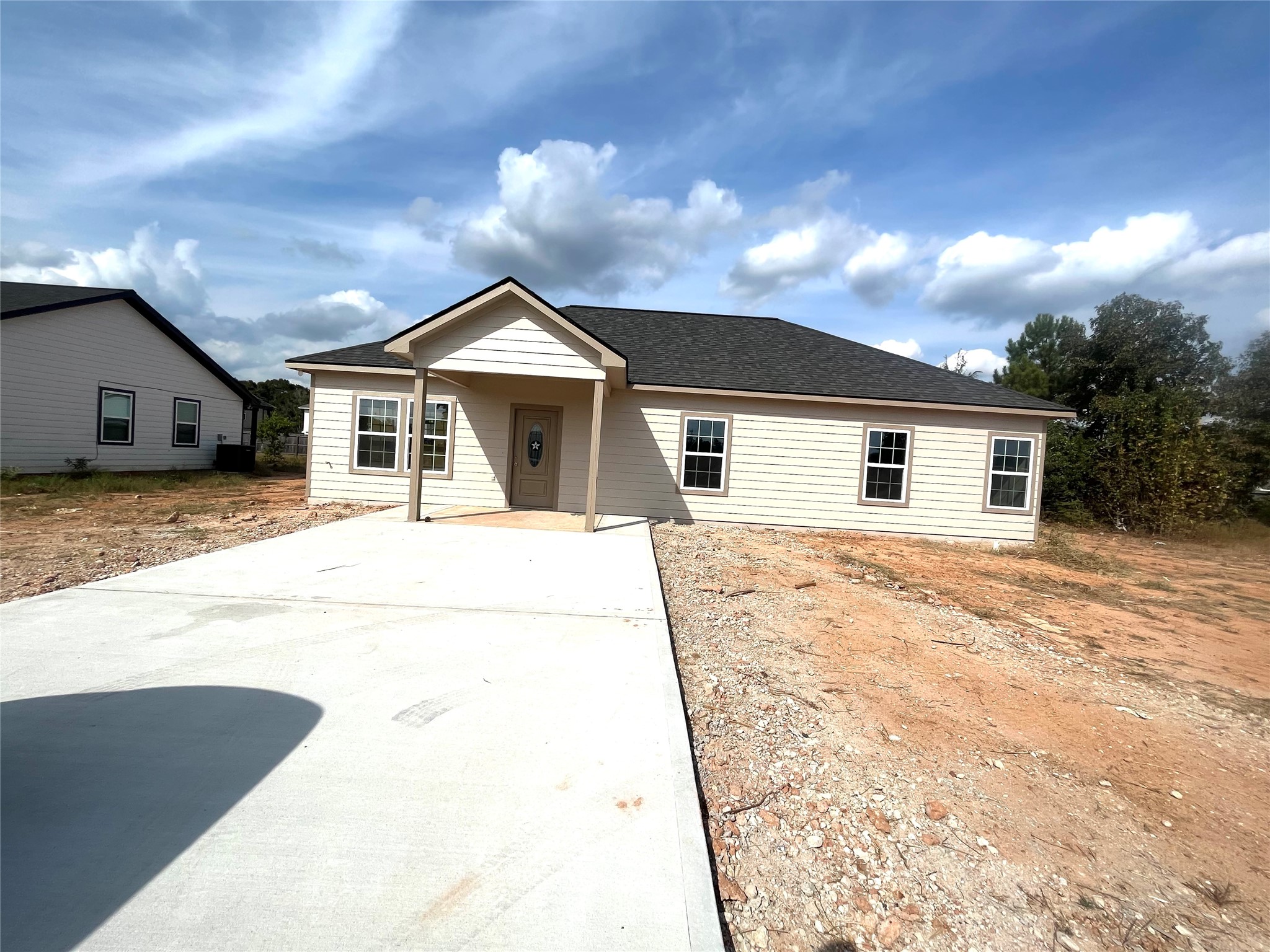 17539 Reno Road Conroe, TX 77306 - Photo 2 of 19 a view of a house with a backyard