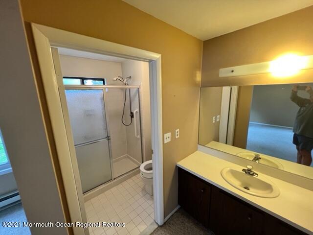 40 Red Hill Road Manchester Township, NJ 08759 - Photo 16 of 33 a bathroom with a double vanity sink mirror and shower