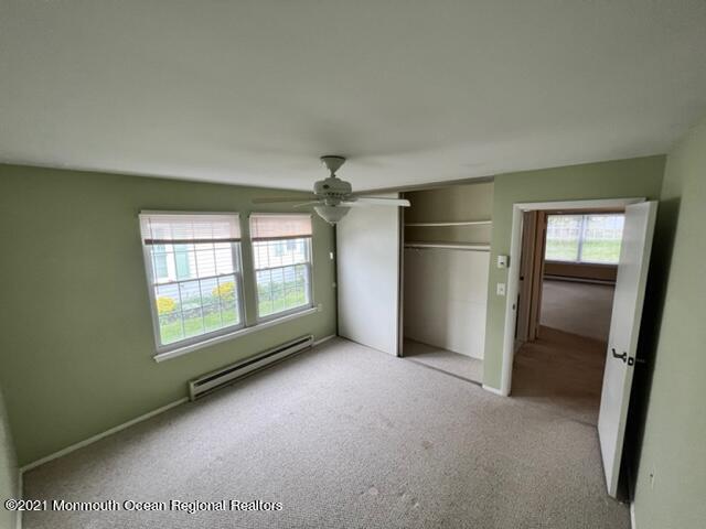 40 Red Hill Road Manchester Township, NJ 08759 - Photo 18 of 33 an empty room with chandelier fan and windows