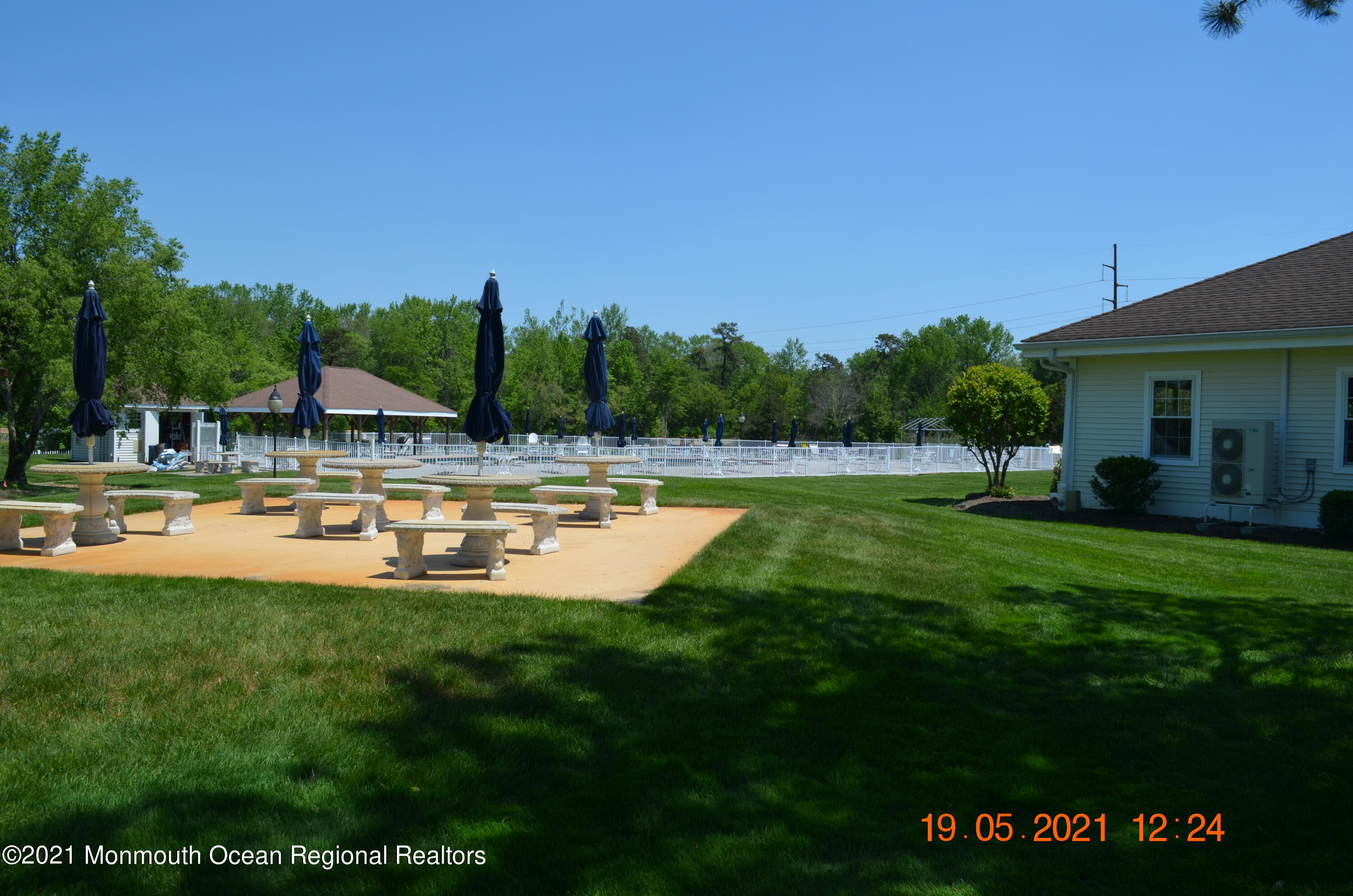 40 Red Hill Road Manchester Township, NJ 08759 - Photo 25 of 33 a view of a swimming pool with a house in the background