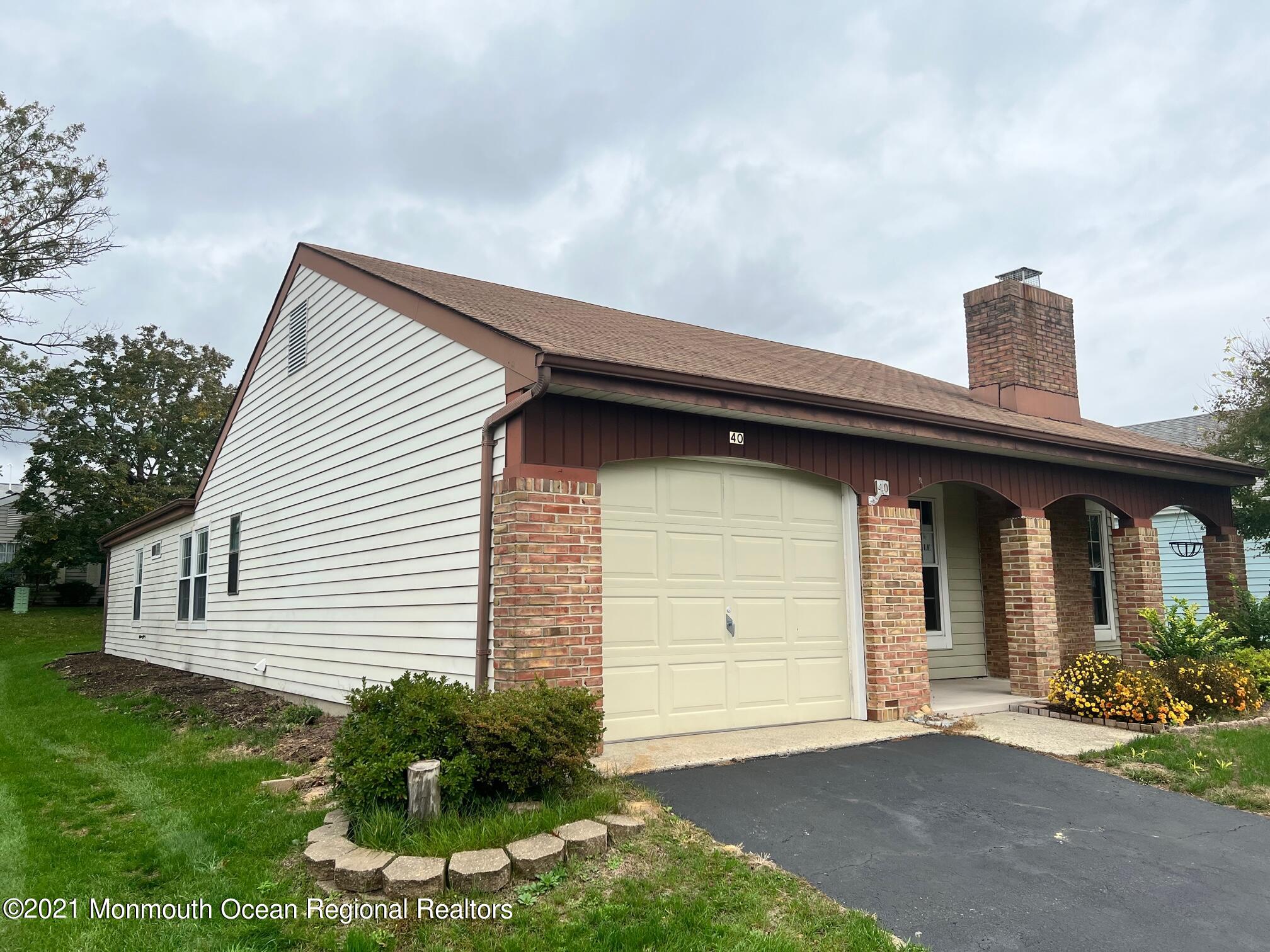 40 Red Hill Road Manchester Township, NJ 08759 - Photo 4 of 33 a front view of a house with a yard