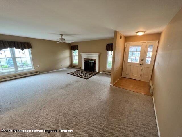 40 Red Hill Road Manchester Township, NJ 08759 - Photo 8 of 33 an empty room with fireplace and windows