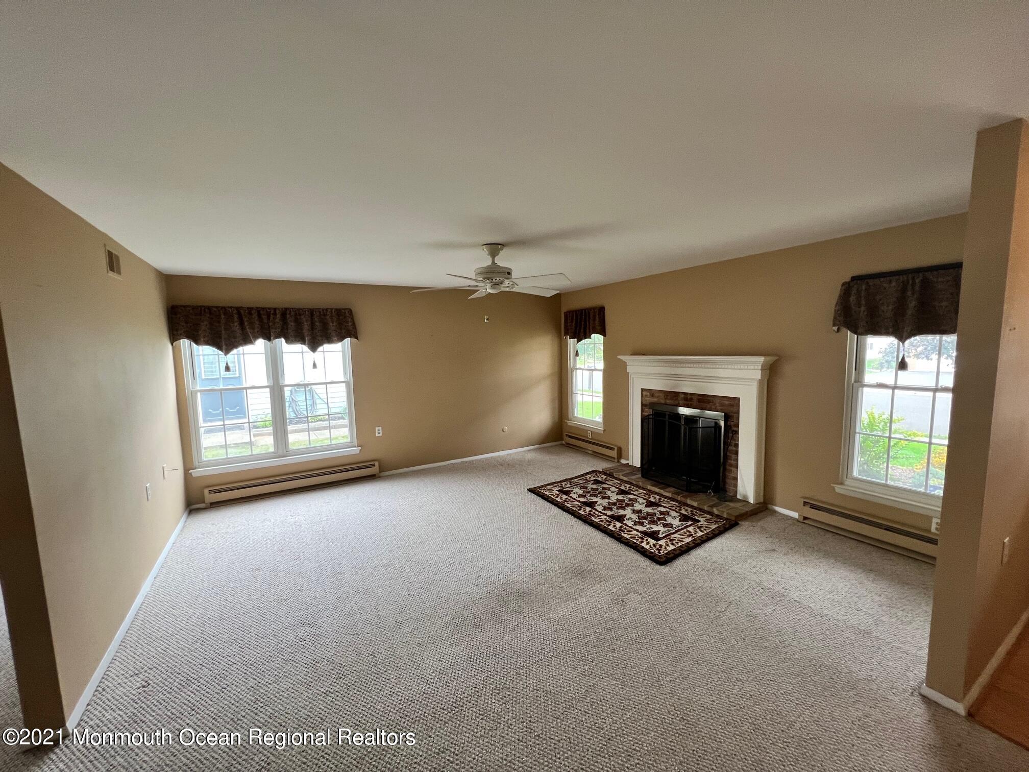 40 Red Hill Road Manchester Township, NJ 08759 - Photo 9 of 33 a view of an empty room with a fireplace and a window