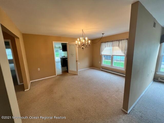 40 Red Hill Road Manchester Township, NJ 08759 - Photo 10 of 33 a view of a livingroom with a chandelier