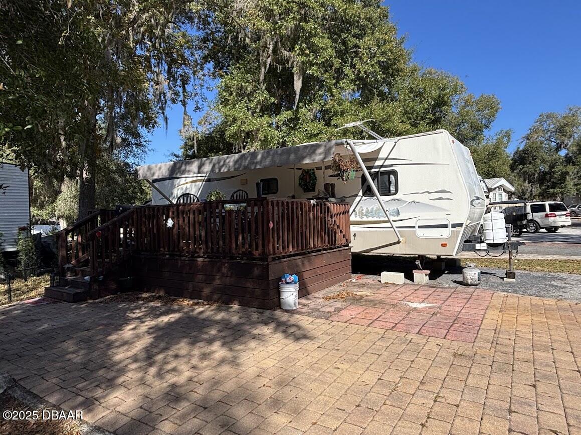 25146 Northeast 140th Loop Salt Springs, FL 32134 - Photo 1 of 46 a view of outdoor space with seating space
