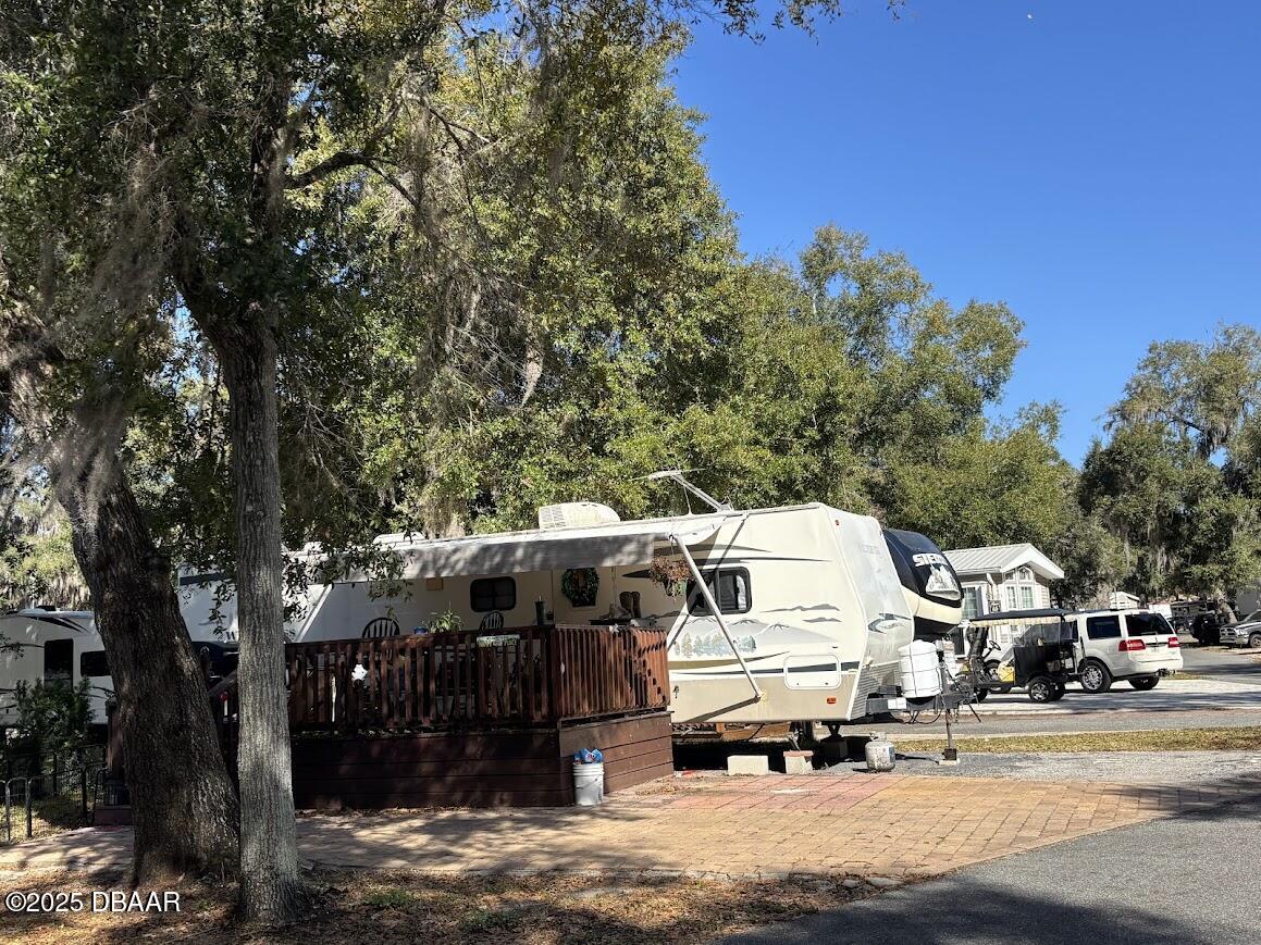 25146 Northeast 140th Loop Salt Springs, FL 32134 - Photo 2 of 46 a view of city street with parked cars