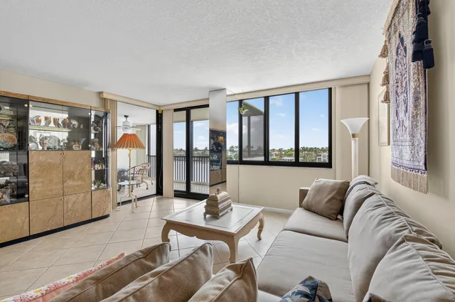 a living room with furniture and white walls