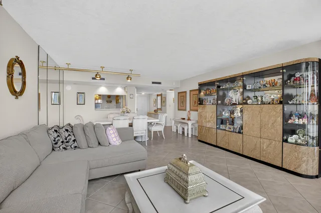 a kitchen with a refrigerator sink stove and cabinets