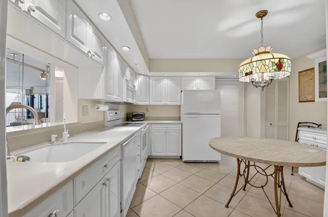 a view of walk in closet with clothes