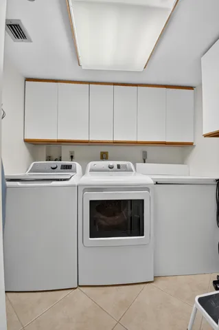 a view of a swimming pool with a lounge chairs