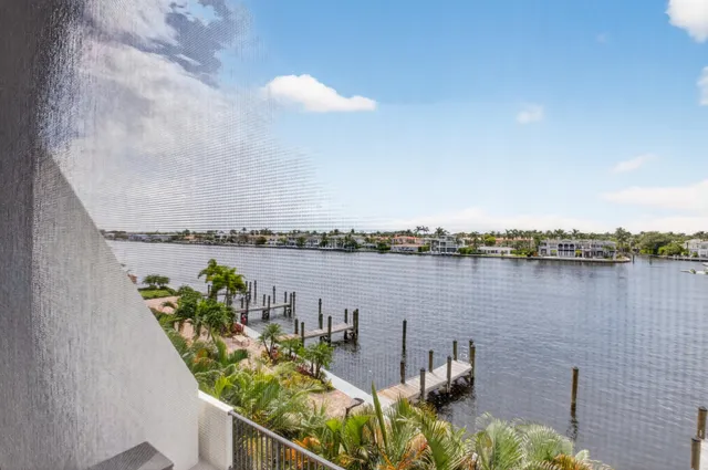 a view of a patio with a table and chairs under an umbrella