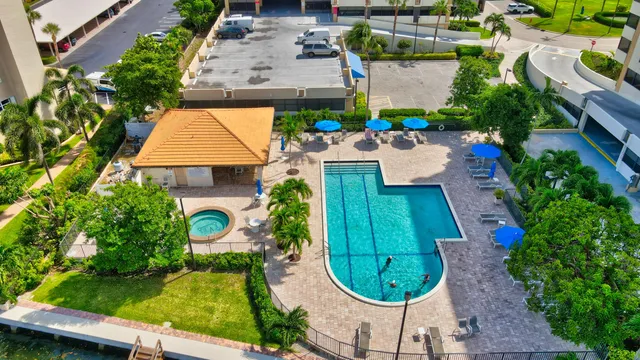 a view of a livingroom with workspace and a window